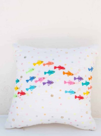 scatter cushion with colourful embroidered fish