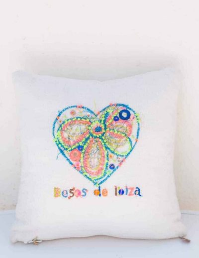 embroidered besos de ibiza and heart on a square cushion