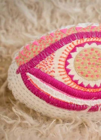 pink embroidered eye cushion