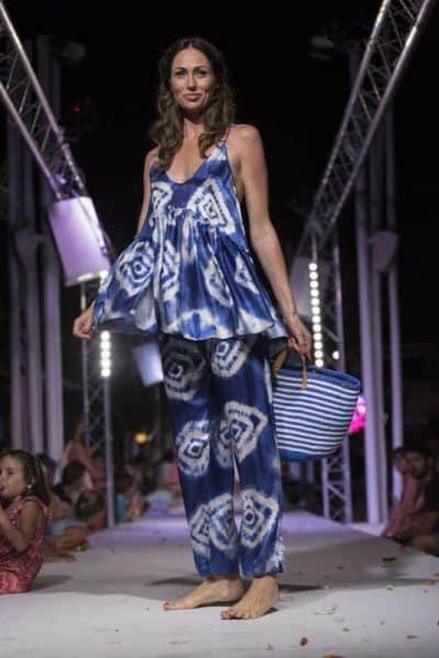 Stylish woman modeling colorful bohemian outfit at La Galeria Elefante event.
