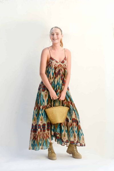 gold leather basket paired with a cream ikat print dress