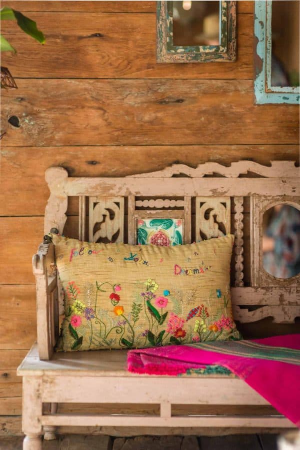 rectangular linen cushion with colourful floral embroidery and Follow Your Dreams written on it
