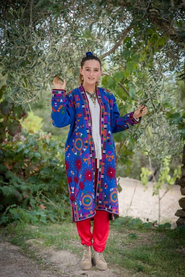 long blue coat with colourful bird embroidery