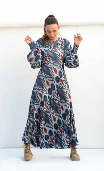 midi length dress in a blue ikat print with red