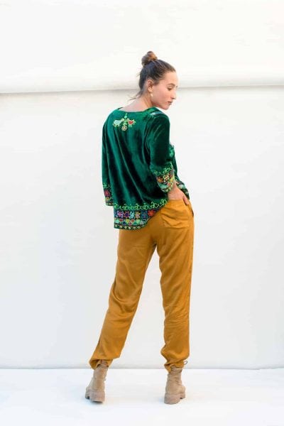 mustard trousers and a short velvet top