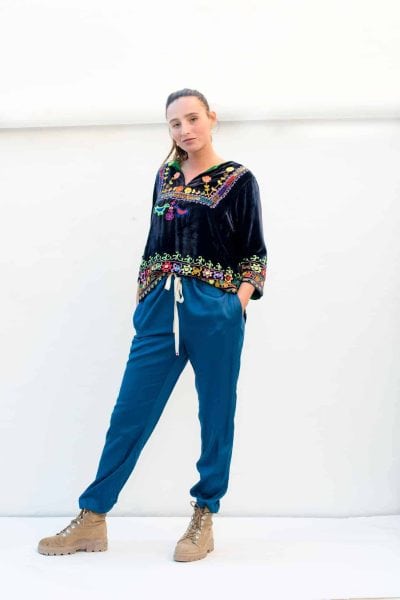 blue trousers with a navy velvet top
