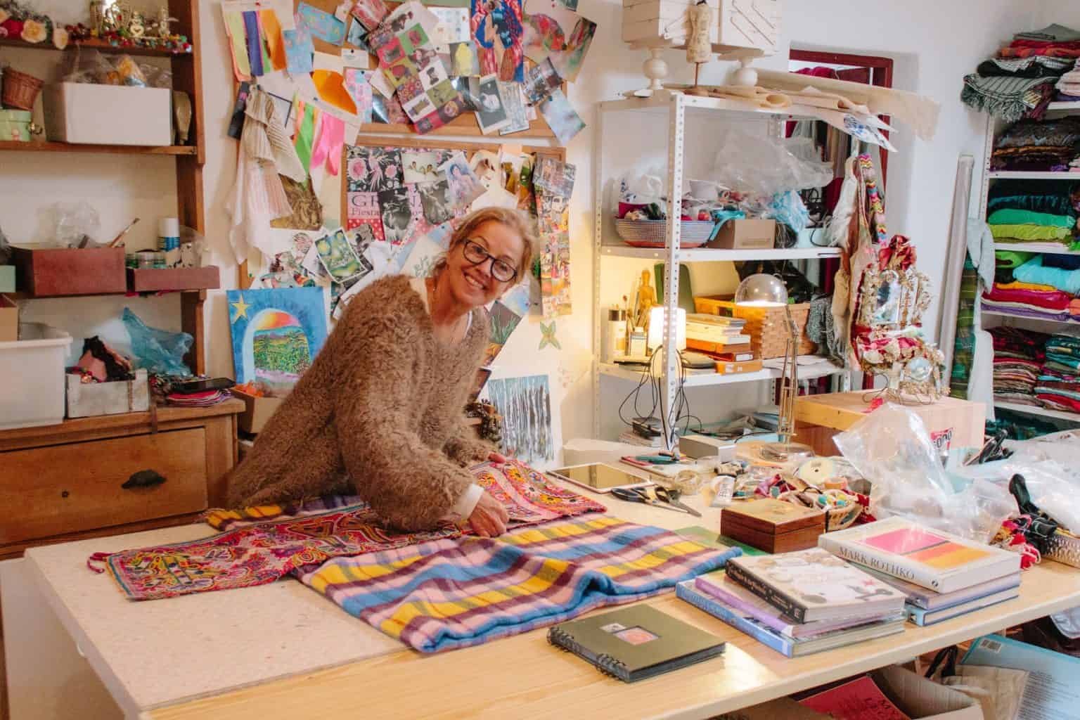 Colorful art studio at La Galeria Elefante showcasing vibrant textiles and creative crafts in a cozy, artistic environment full of colorful fabrics and unique handmade artwork.