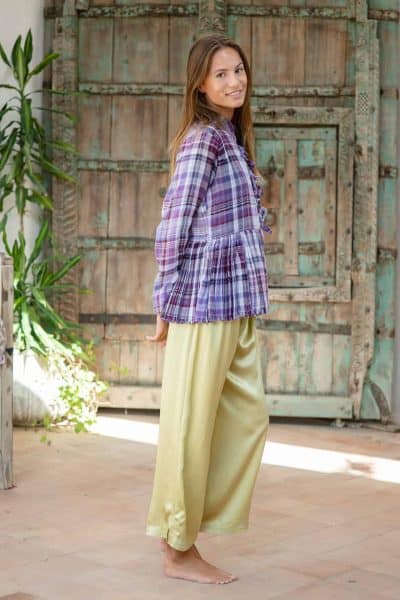 olive green silk trousers worn with purple checked jacket