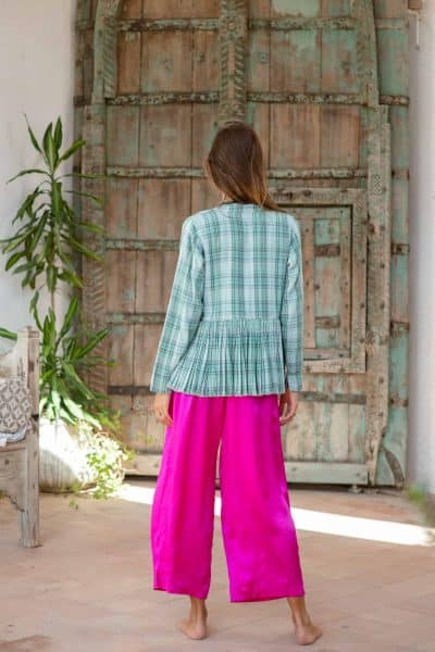 fuchsia silk pants with a green tartan jacket