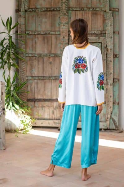 blue silk trousers worn with floral vintage top
