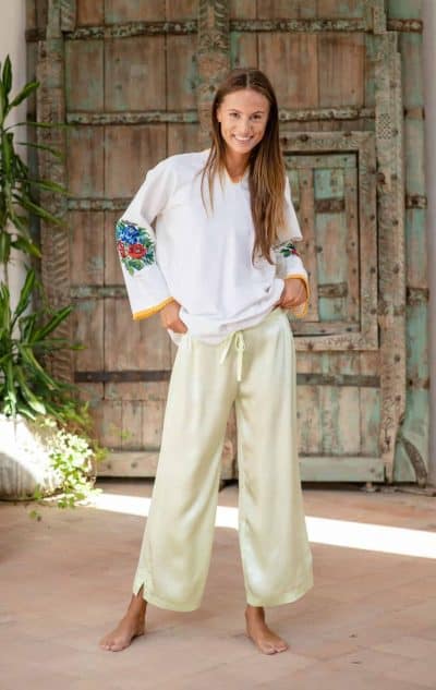 beaded floral embroidered top worn with pale green silk trousers