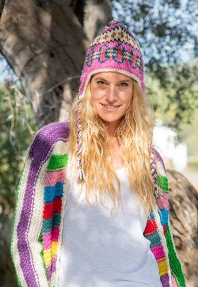 striped cardigan worn with pink woolly hat