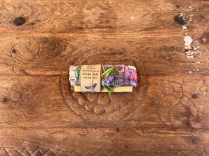 La Galeria Elefante Ibiza Artisan bundle of palo santo, lavender and herbs on wooden surface for meditation or cleansing.
