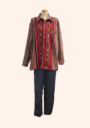 A colorful striped Jaisalmer shirt displayed on a mannequin, paired with dark pants, showcasing traditional Indian textile patterns and vibrant design elements from La Galeria Elefante.