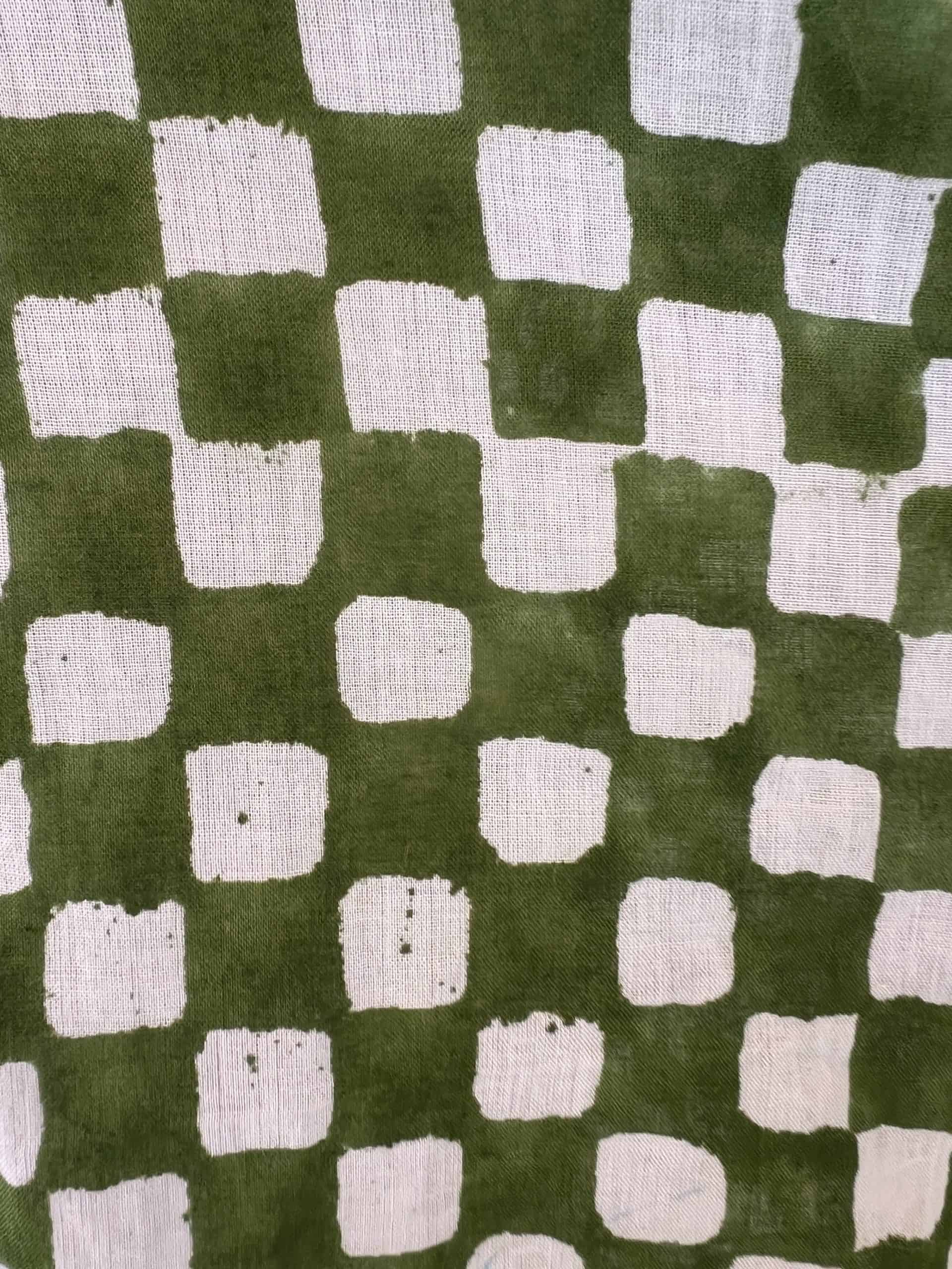 La Galeria Elefante Ibiza Handmade fabric with green and white checkered pattern, artisan textile design.