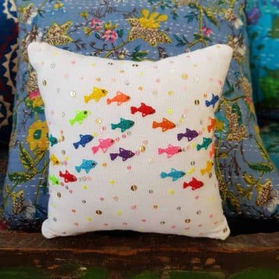 small square cushion with embroidered fish